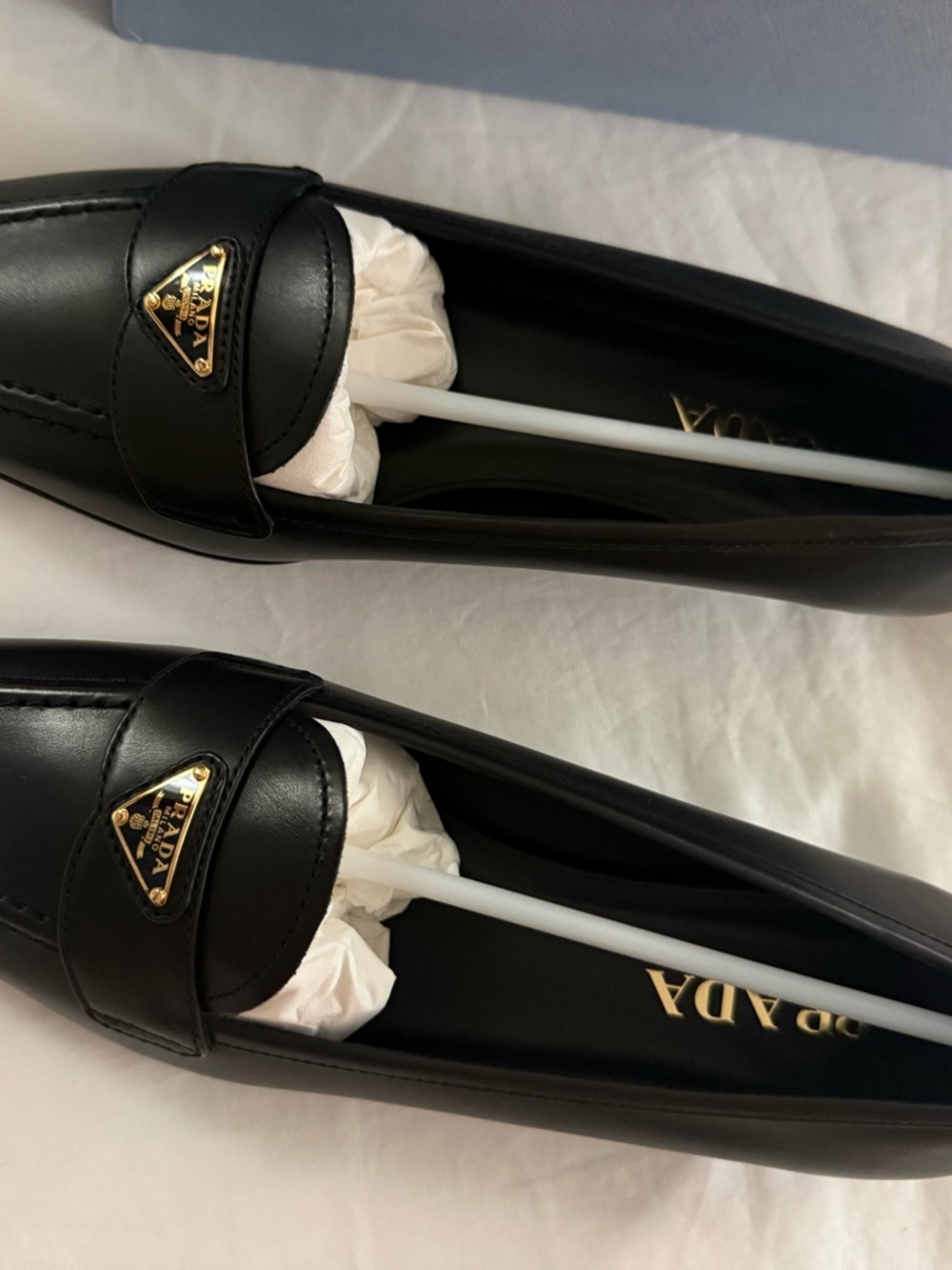 Prada Black Leather Penny Loafers with Gold Triangle Logo